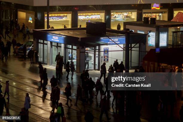 Passers-by pass a new police station at Alexanderplatz on December 15, 2017 in Berlin, Germany. Alexanderplatz, at the heart of Berlin, has seen a...