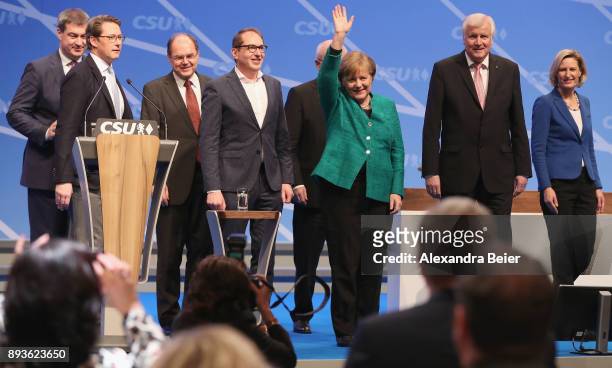 German Chancellor and leader of the German Christian Democrats Angela Merkel waves next to Horst Seehofer , Governor of Bavaria and leader of the...