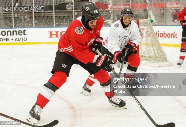 Gabriel Dumont of the Ottawa Senators defends against teammate Erik Karlsson during practice at Lansdowne Park on December 15, 2017 in Ottawa, Canada.