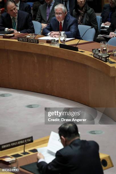 Secretary of State Rex Tillerson listens as North Korea's ambassador to the United Nations Ja Song-nam speaks during a United Nations Security...