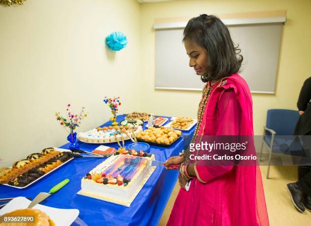 Popi cutting the cake during a party thrown for her at Toronto General Hospital. In September in her hometown in Bangladesh, Popi Rani Das took ill...
