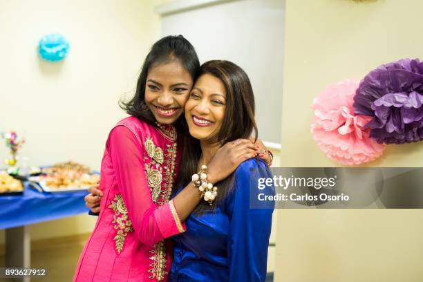 Popi poses for photos with her social worker Shobha Sawh during a party thrown for Popi at Toronto General Hospital. In September in her hometown in...