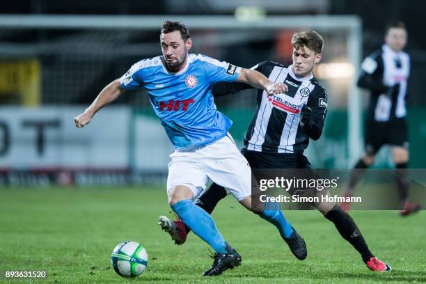 Maik Kegel of Fortuna Koeln is challenged by Lukas Laemmel of Aalen during the 3. Liga match between VfR Aalen and SC Fortuna Koeln at Ostalb Stadion...