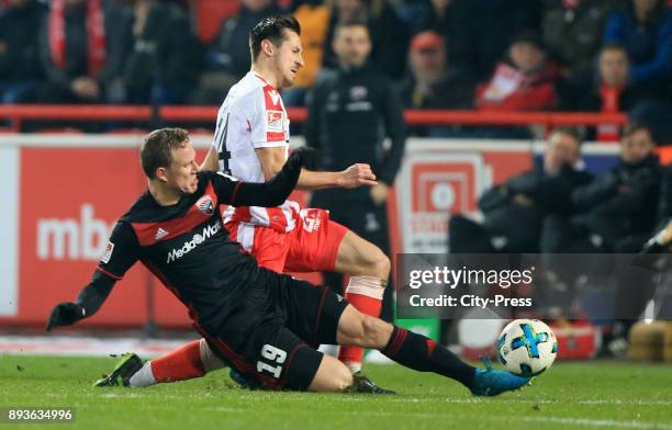 Marcel Gaus of FC Ingolstadt 04 and Steven Skrzybski of 1 FC Union Berlin during the game between Union Berlin and dem FC Ingolstadt 04 on december...