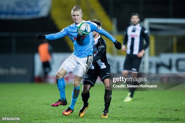 Michael Kessel of Fortuna Koeln is challenged by Maximilian Welzmueller of Aalen during the 3. Liga match between VfR Aalen and SC Fortuna Koeln at...