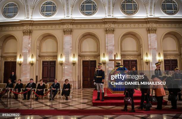 People pay their respects to the late King Michael I of Romania inside the former Royal Palace that houses the National Arts Museum, where the coffin...