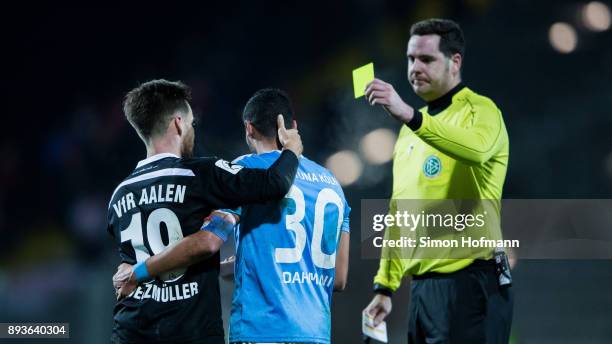 Maximilian Welzmueller of Aalen hugs Hamdi Dahmani of Fortuna Koeln during the 3. Liga match between VfR Aalen and SC Fortuna Koeln at Ostalb Stadion...