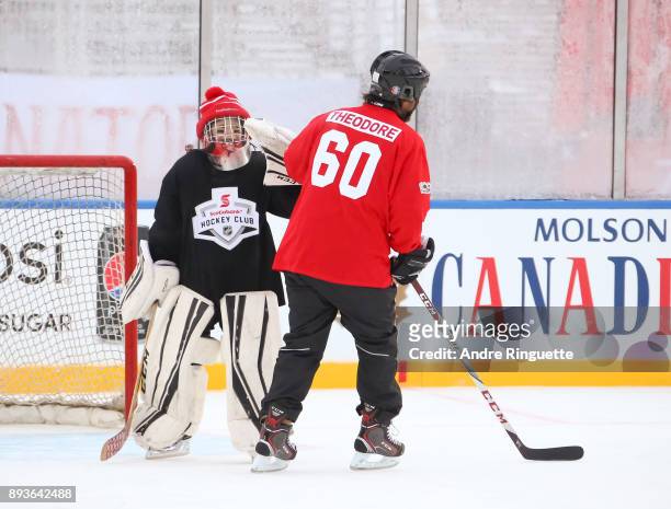 Montreal Canadiens alumni José Théodore high fives a Scotiabank skater to celebrate the sponsorship of 1 million minor hockey league kids in advance...
