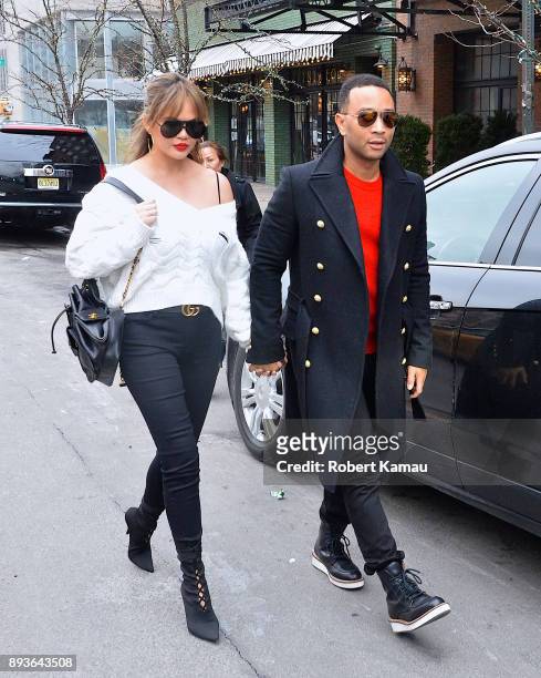 Chrissy Teigen and John Legend are seen in Manhattan on December 14, 2017 in New York City.