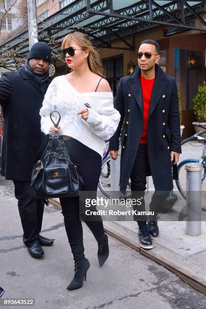 Chrissy Teigen and John Legend are seen in Manhattan on December 14, 2017 in New York City.