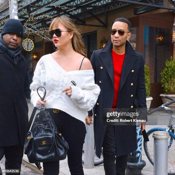 Chrissy Teigen and John Legend are seen in Manhattan on December 14, 2017 in New York City.