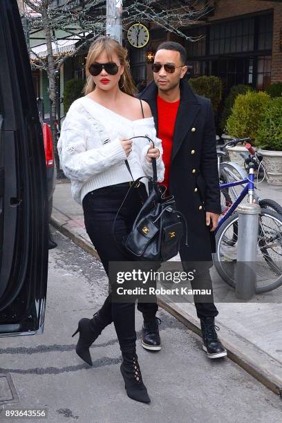 Chrissy Teigen and John Legend are seen in Manhattan on December 14, 2017 in New York City.