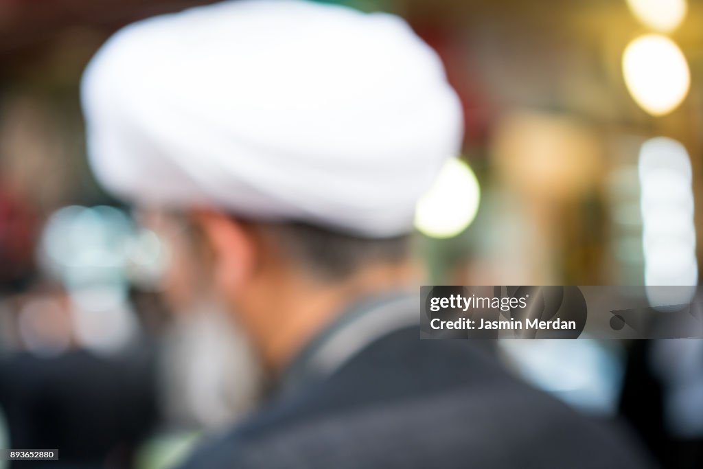 People on street, blurred man