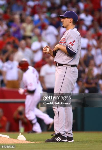 Carl Pavano of the Cleveland Indians looks on after giving up a solo home run to Juan Rivera of the Los Angeles Angels of Anaheim in the second...