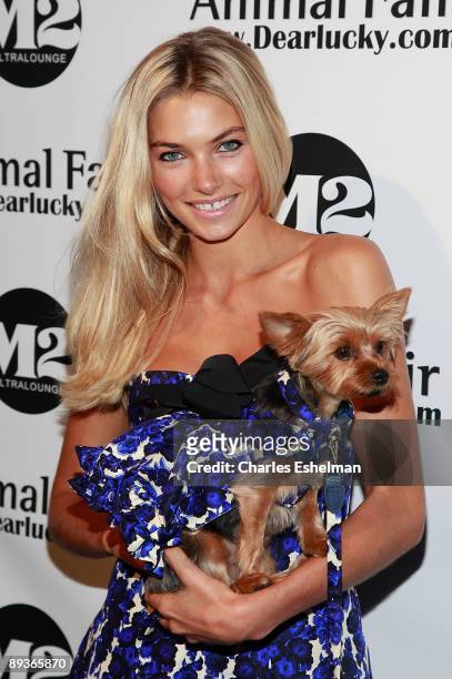 Model Jessica Hart and her dog Charlie attend Animal Fair's 10th Annual Paws For Style at M2 Ultra Lounge on July 27, 2009 in New York City.