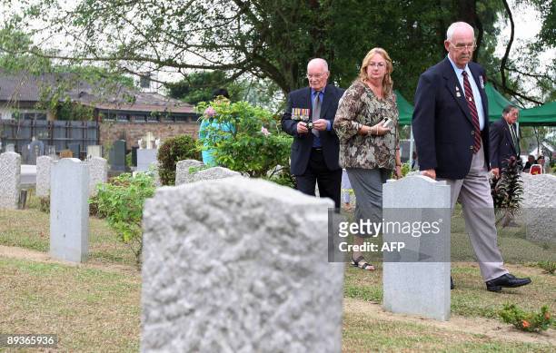 Asia-WWII-history-cemeteries BY ROMEN BOSE A picture dated June 11, 2009 shows visitors walking among the tombstones during a rememberance ceremony...