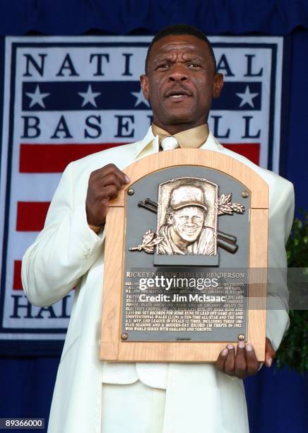 Inductee Rickey Henderson holds his plaque after his induction into the Baseball Hall of Fame at Clark Sports Center during the Baseball Hall of Fame...