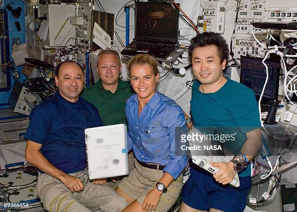 In this photo provided by NASA, astronauts Mark Polansky, STS-127 commander, Doug Hurley, pilot, Canadian Space Agency astronaut Julie Payette and...