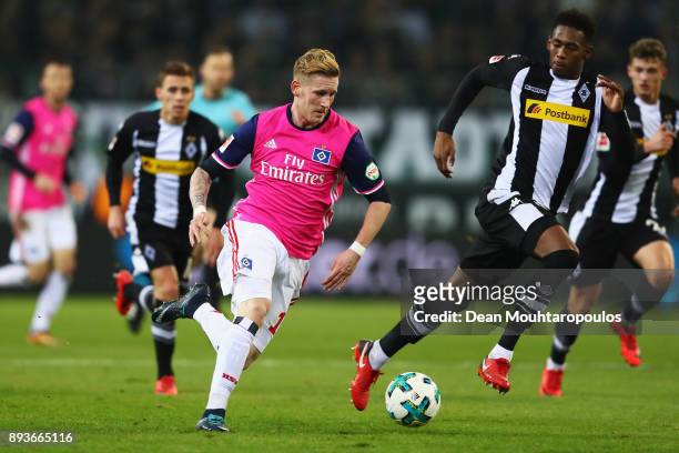 Andre Hahn of Hamburg battles for the ball with Reece Oxford of Borussia Monchengladbach during the Bundesliga match between Borussia...