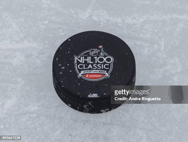 Scotiabank NHL100 Classic practice puck on the ice during an Ottawa Senators practice session at Lansdowne Park on December 15, 2017 in Ottawa,...