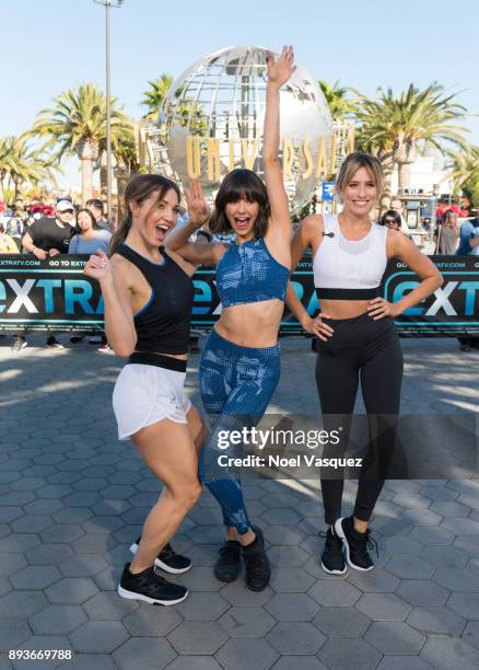 Lissa Bankston, Nina Dobrev and Renee Bargh pose together at "Extra" at Universal Studios Hollywood on December 15, 2017 in Universal City,...