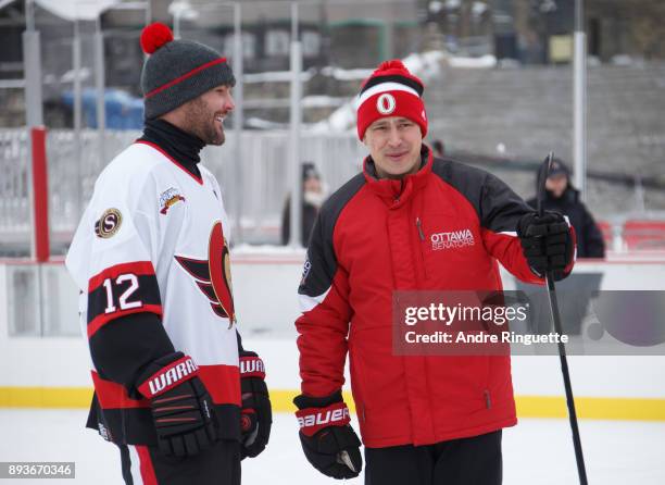 Ottawa Senators alumnus Mike Fisher shares a laugh with head coach Guy Boucher at Centennial Fan Arena on Parliament Hill ahead of the Scotiabank...