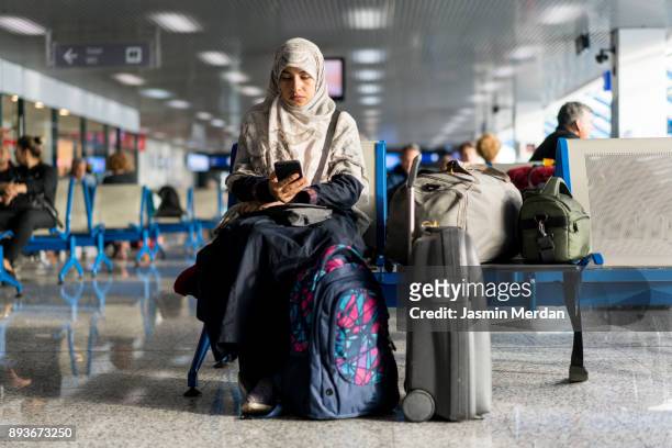 Muslim woman waiting on airport