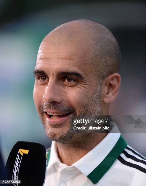 Bundesliga 2013/2014 Testspiel FC Bayern Muenchen - Paulaner Traumelf Trainer Pep Guardiola nachdenklich beim Fernsehinterview