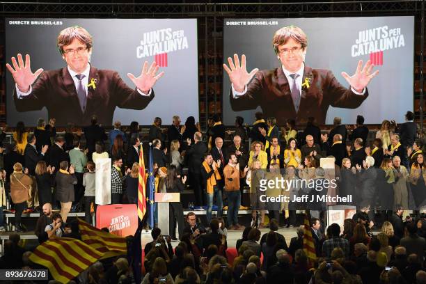 Junts Per Catalunya party candidates for the forthcoming Catalan election, listen to deposed regional president Carles Puigdemont as he takes part...