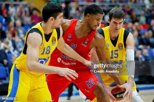 Kyle Hines of CSKA Moscow vies with Itay Segev and Jake Cohen of Maccabi Fox during the Turkish Airlines Euroleague match between CSKA Moscow and...