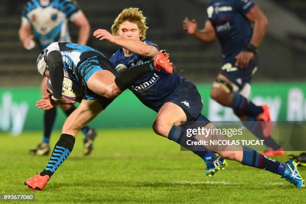 Bordeaux-Begles' Australian wing Blair Connor tackles Yenisei's winger Richard Kingi during the European Challenge Cup rugby match between...