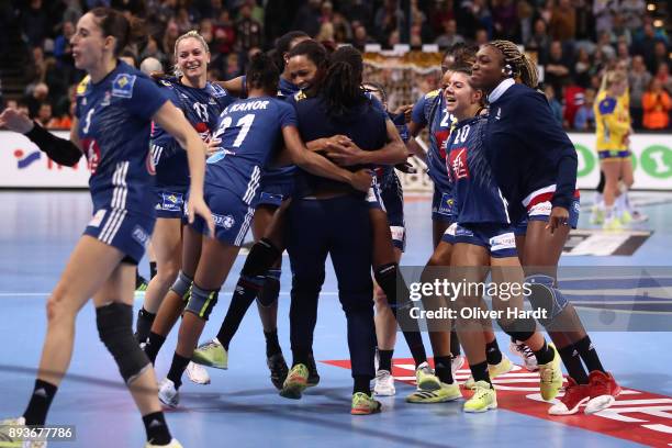 Team of France celebrate after the IHF Women's Handball World Championship Semi Final match between Sweden and France at Barclaycard Arena on...