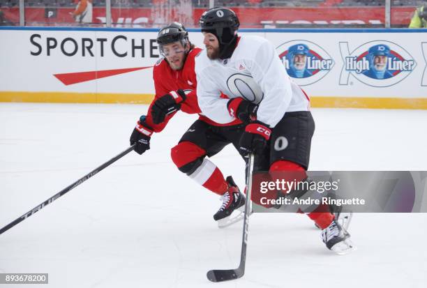 Mike Hoffman and Zack Smith of the Ottawa Senators compete during a practice session ahead of the Scotiabank NHL100 Classic, at Lansdowne Park on...