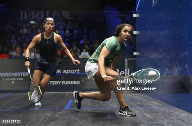 Raneem El Welily of Egypt plays a backhand shot against Nicol David of Malaysia during their Quarter Final match in the AJ Bell PSA World Squash...