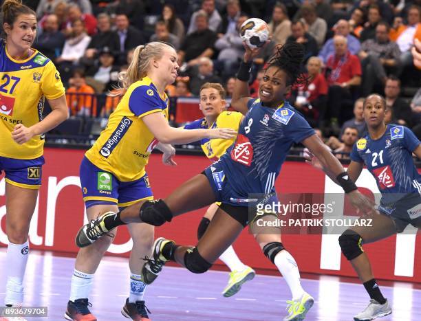 France´s Laurisa Landre shoots during the IHF Womens World Championship handball half-final match Sweden vs France on December 15, 2017 in Hamburg,...