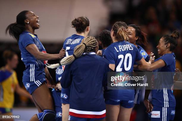 Team of France celebrate after the IHF Women's Handball World Championship Semi Final match between Sweden and France at Barclaycard Arena on...