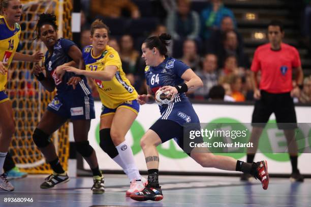 Alexandra Lacrabere of France and Sabina Jacobsen of Sweden challenges for the ball during the IHF Women's Handball World Championship Semi Final...