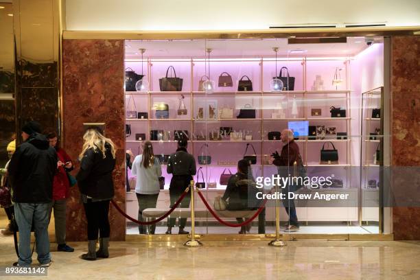 Customers shop at a new Ivanka Trump brand store in the lobby of Trump Tower, December 15, 2017 in New York City. Ivanka Trump's fashion company...