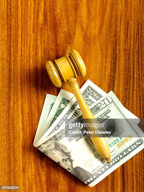 auctioneer's gavel on us dollar notes. - auction stock pictures, royalty-free photos & images