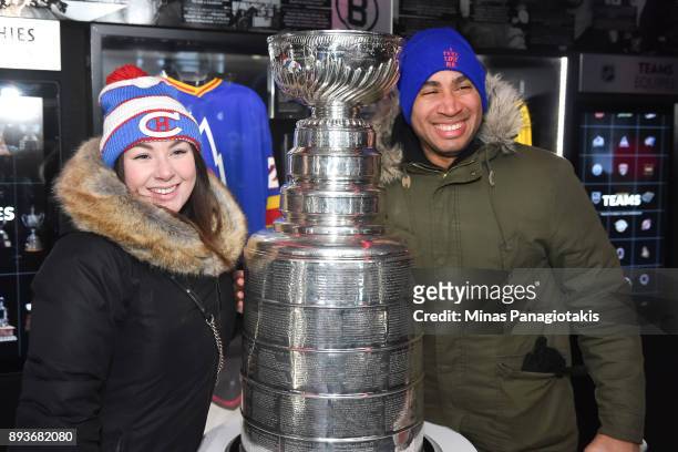 Fans pose with the Stanley Cup in the Centennial Fan Arena on Parliament Hill in advance of the 2017 Scotiabank NHL100 Classic on December 15, 2017...
