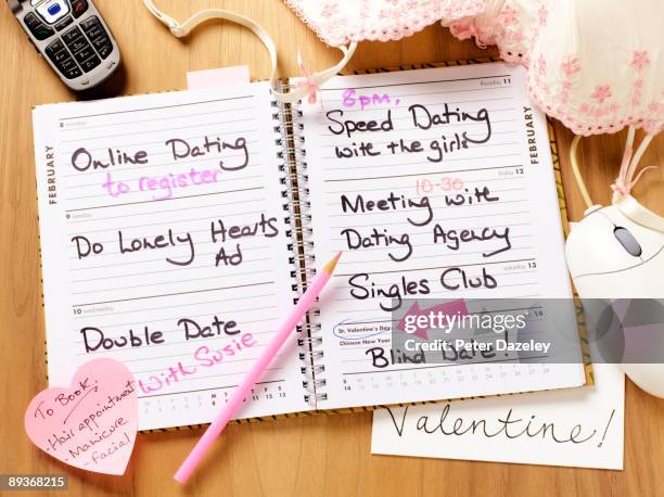 lonely hearts diary open. - lonely hearts stock pictures, royalty-free photos & images