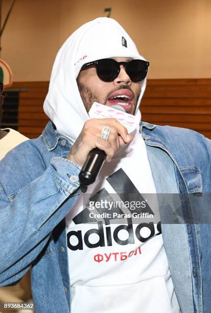 Singer Chris Brown makes a surprise appearance at V-103 Atlanta Winterfest pop-up at Columbia Middle School where he donated $50,000 on December 15,...