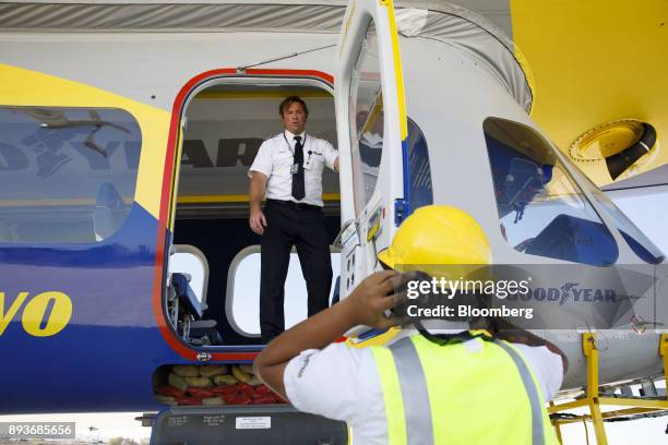 Pilot speaks with a ground crew member after landing the Goodyear Tire & Rubber Co. Wingfoot Two blimp at the company's airship base in Carson,...