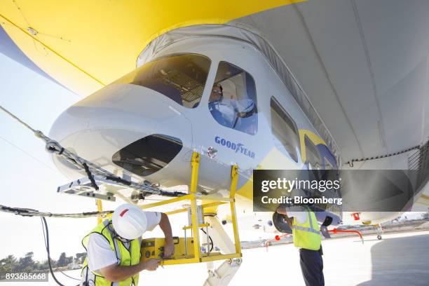 Pilot gives a thumbs up after the Goodyear Tire & Rubber Co. Wingfoot Two blimp lands at the company's airship base in Carson, California, U.S., on...