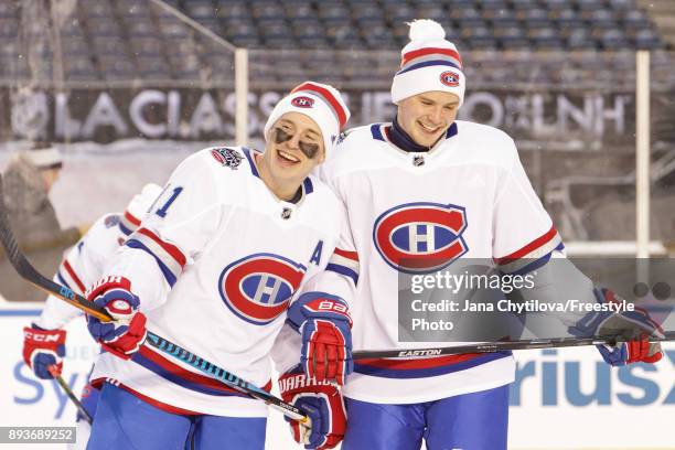 Brendan Gallagher and Artturi Lehkonen of the Montreal Canadiens share a laugh during practice at Lansdowne Park on December 15, 2017 in Ottawa,...