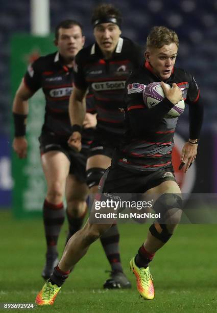 Darcy Graham of Edinburgh runs with the ball during the European Rugby Challenge Cup match between Edinburgh and Krasny Yar at Murrayfield Stadium on...