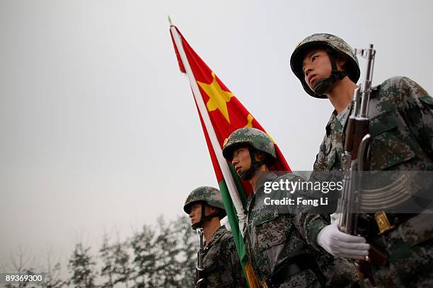 People's Liberation Army soldiers show their skills during a reporting trip to the Third Guard Division of the PLA on July 28, 2009 in Beijing,...