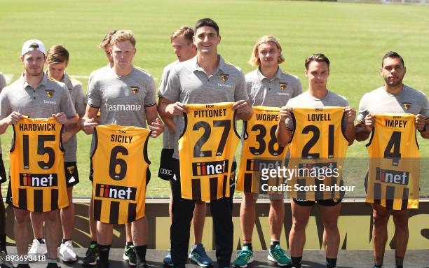 Blake Hardwick, James Sicily, Marc Pittonet, James Worpel, Kieran Lovell and Jarman Impey of the Hawks hold their new guernsey numbers at the jumper...