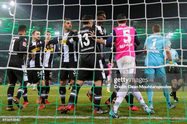 Raffael of Borussia Monchengladbach scores his teams third goal of the game with team mates then speaks to Goalkeeper, Christian Mathenia and Mergim...