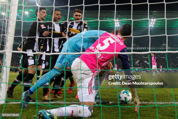 Raffael of Borussia Monchengladbach scores his teams third goal of the game with team mates then speaks to Goalkeeper, Christian Mathenia and Mergim...